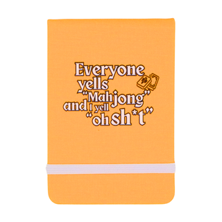 Orange notebook with text design on a white background