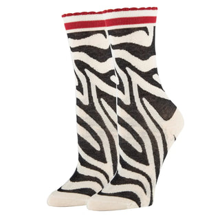 Zebra patterned socks with a red top on a white background