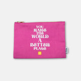 Pink pouch with motivational quote on a white background