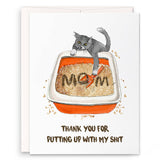 Card with a cat on a litter box labeled 'Mom' and humorous text, on a white background.