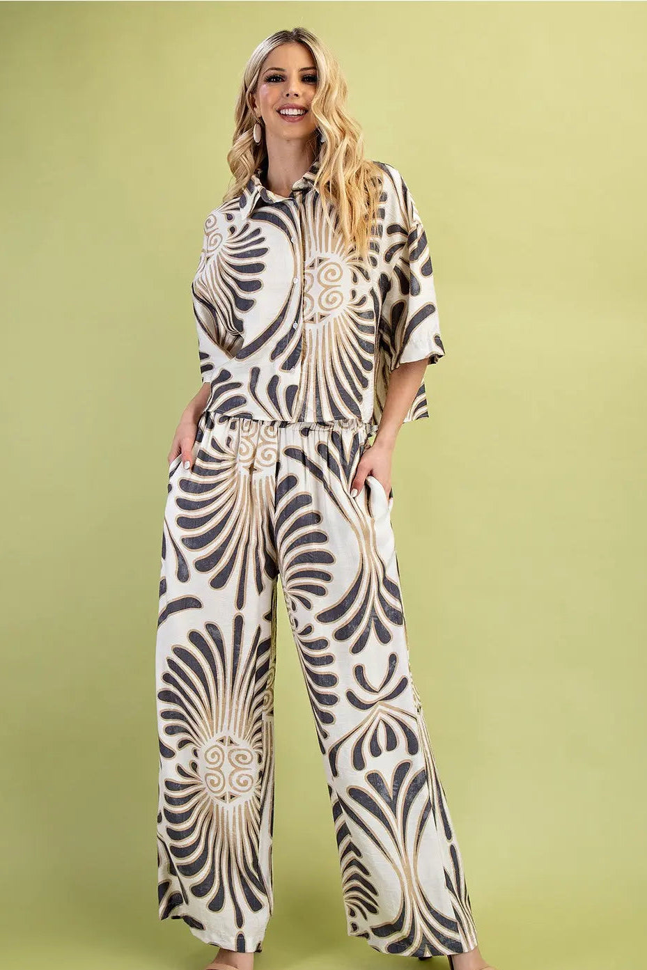 Woman wearing a zebra print outfit on a green background