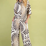 Woman wearing a zebra print outfit on a green background