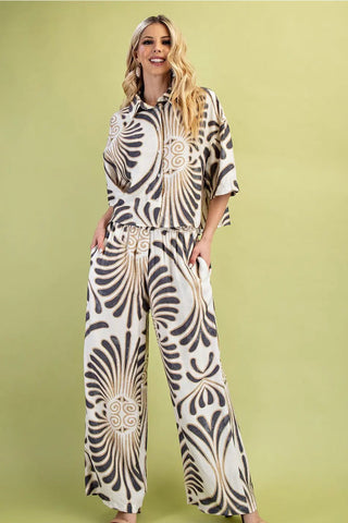 Woman wearing a zebra print outfit on a green background