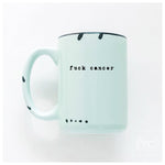 Mint green mug with 'fuck cancer' text on a white background