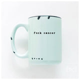 Mint green mug with 'fuck cancer' text on a white background