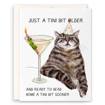 Birthday card with a cat and cocktail illustration, text 'Just a tini bit older and ready to head home a tini bit sooner'.