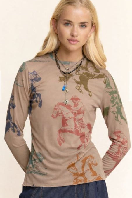 Woman wearing a long-sleeve shirt with horse prints on a beige background