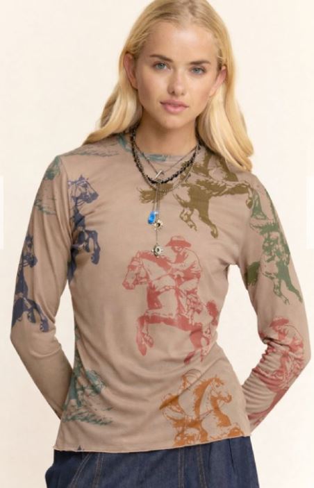 Woman wearing a long-sleeve shirt with horse prints on a beige background