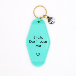 Turquoise keychain with text 'Bitch, Don't Lose Me' on a white background