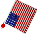 American flag patch with a red pom-pom on a white background