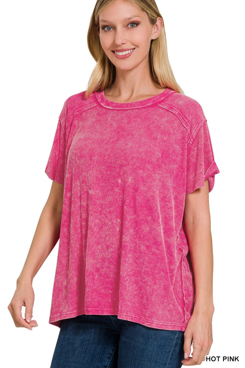 Woman wearing a hot pink t-shirt on a white background