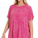 Woman wearing a hot pink t-shirt on a white background
