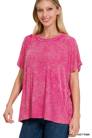 Woman wearing a hot pink t-shirt on a white background