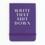 Purple notebook with white text 'WRITE THAT SHIT DOWN' on a white background