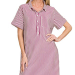 Woman wearing a red and white striped shirt dress on a white background