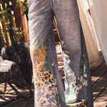 DENIM look pants with animal print.
