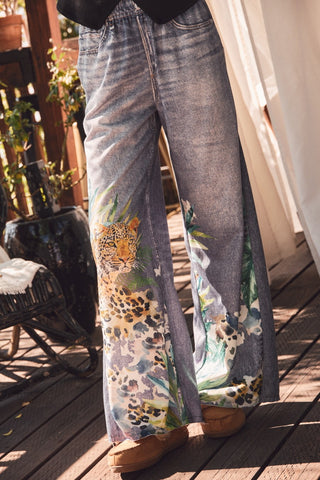 DENIM look pants with animal print.