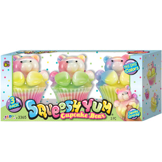 Box of Squeebly Yum Cupcake Bear toys with colorful packaging on a white background
