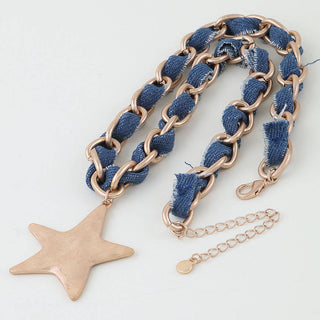 Necklace with blue fabric chain and star pendant on a white background