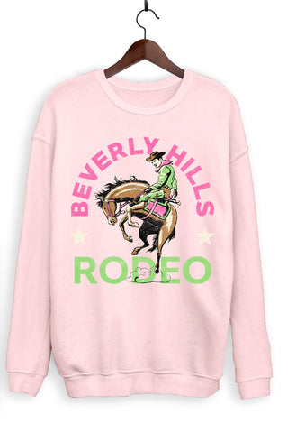 Pink sweatshirt with 'Beverly Hills Rodeo' graphic on a hanger against a white background