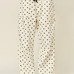 Polka dot pants with a plain background