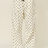 Polka dot pants with a plain background