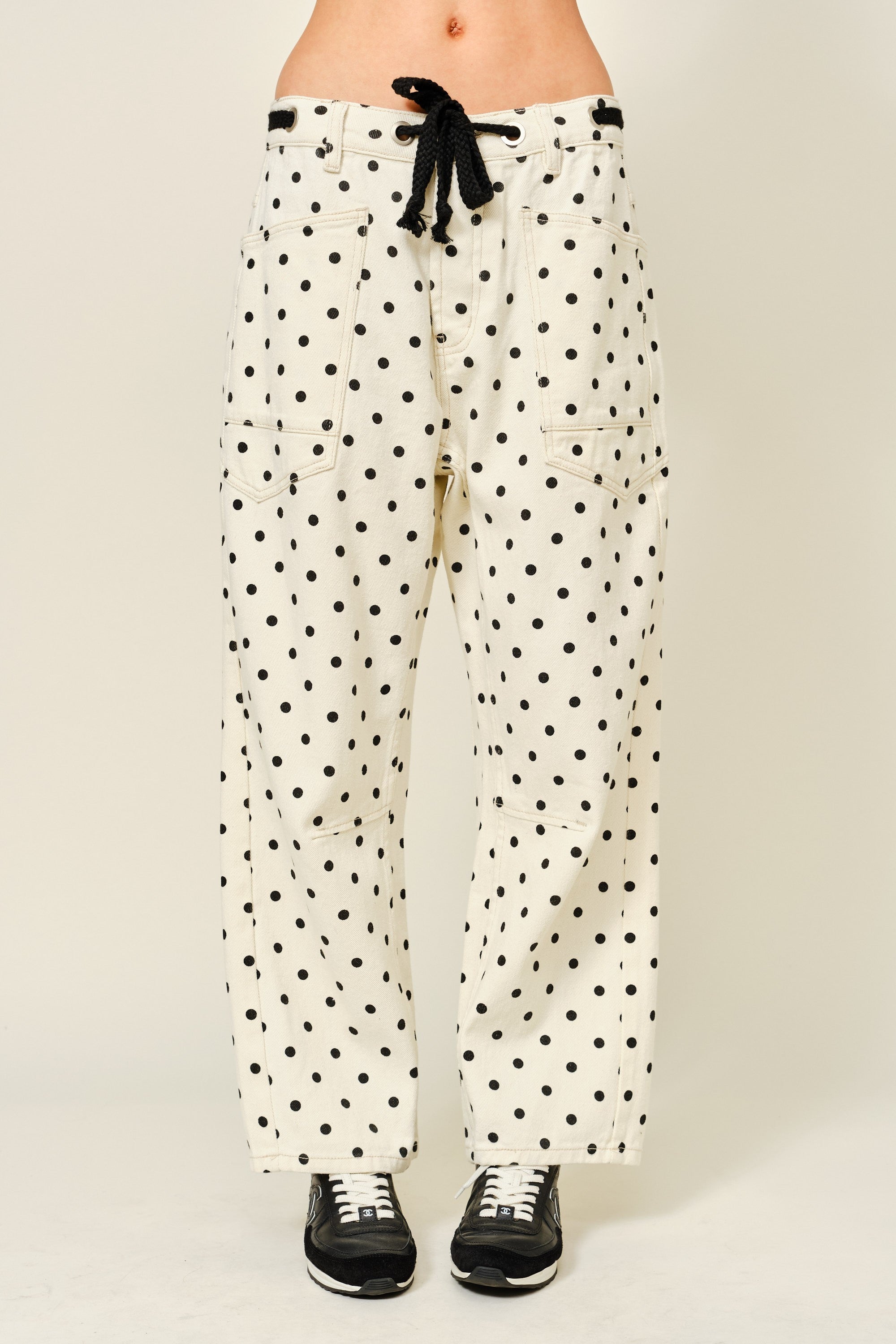 Polka dot pants with a plain background