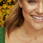 NOLA STUD EARRINGS IN SAME EAR.
