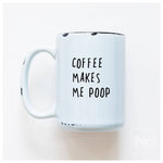 White mug with text 'COFFEE MAKES ME POOP' on a white background