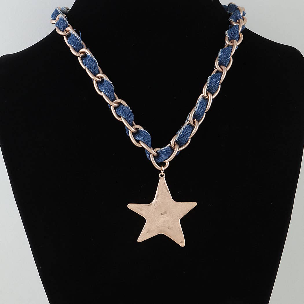 Necklace with blue chain and star pendant on a black mannequin