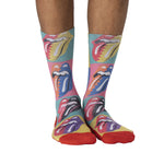 Colorful socks with Rolling Stones logo worn by a person on a white background
