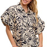 Woman wearing a patterned blouse with a pink background