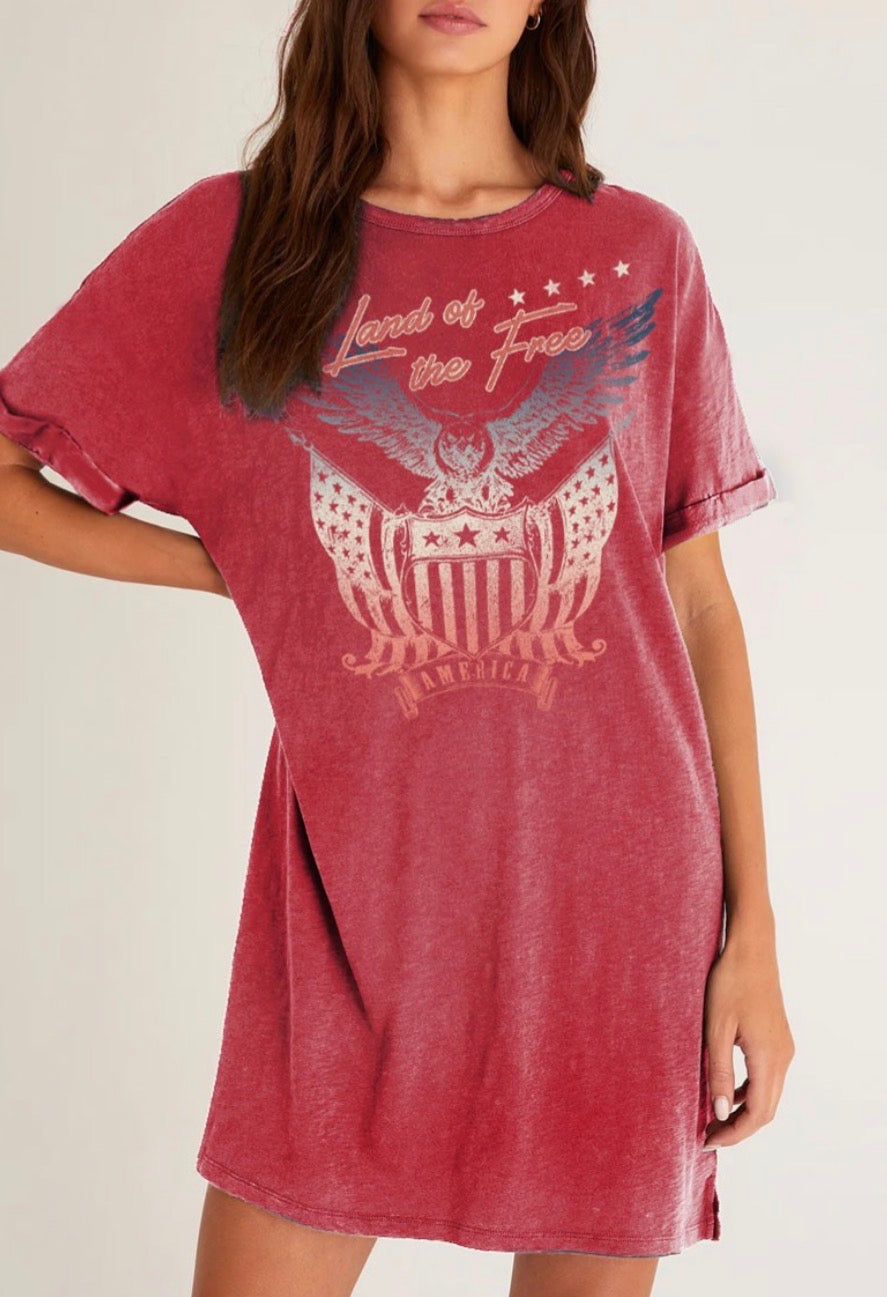 Red t-shirt dress with eagle graphic and text on a plain background