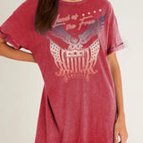 Red t-shirt dress with eagle graphic and text on a plain background