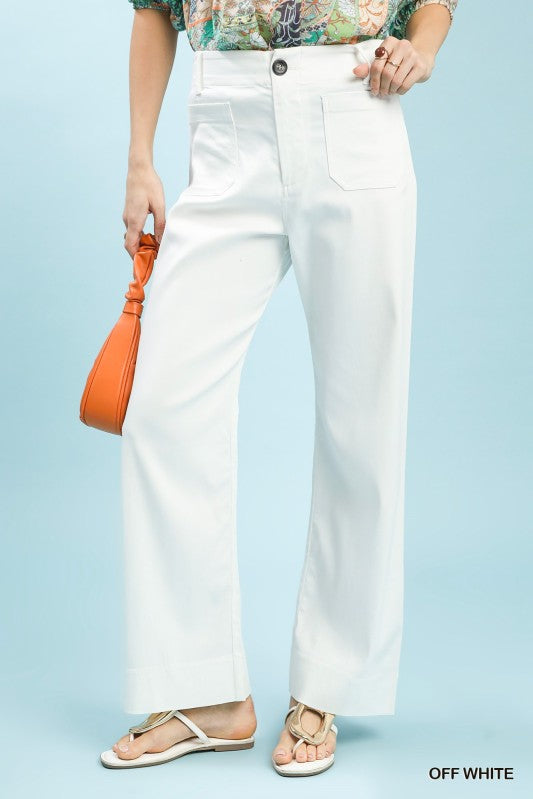 Person wearing off-white pants with a light blue background