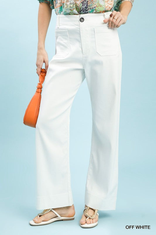 Person wearing off-white pants with a light blue background