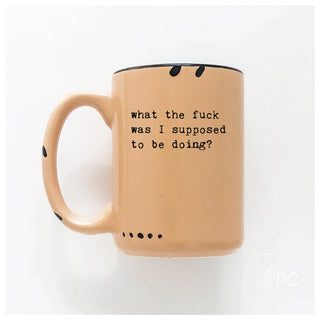 Beige mug with black text on a white background