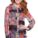 Woman wearing a colorful patterned shirt on a white background