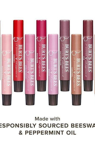 Set of Burt's Bees lip balms in various shades on a white background.