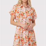 Woman wearing a floral dress on a white background
