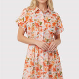 Woman wearing a floral dress on a white background