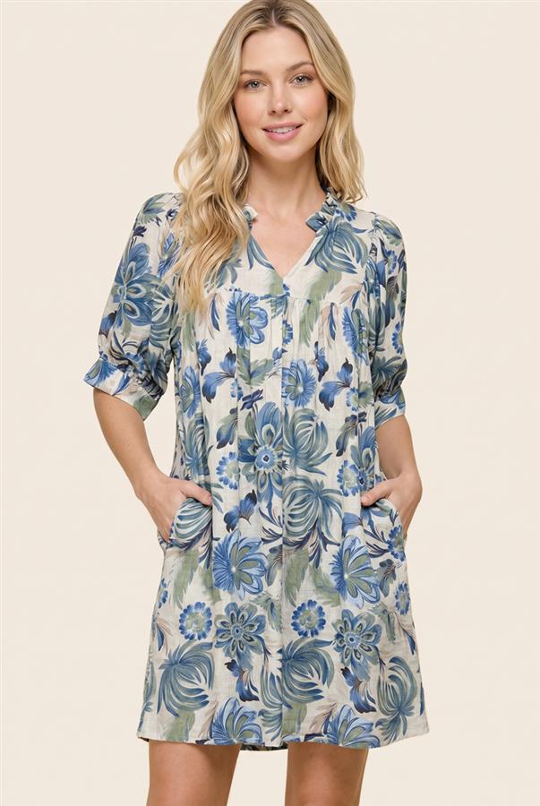 Woman wearing a floral dress with a beige background