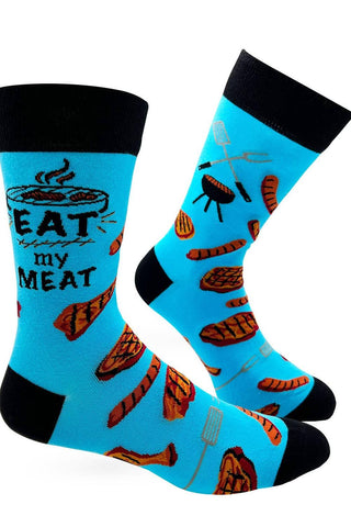 Blue socks with grill and meat designs on a white background