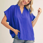 ROYAL BLUE shirt on blonde model with denim shorts.