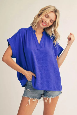 ROYAL BLUE shirt on blonde model with denim shorts.