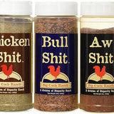 Five containers of Big Cock Ranch seasoning with colorful labels.