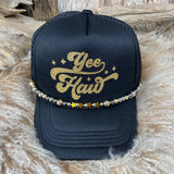 Black cap with 'Yee Haw' in gold glitter on a fur surface