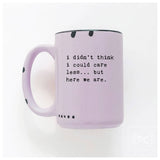 Purple mug with text 'i didn't think i could care less... but here we are.' on a white background