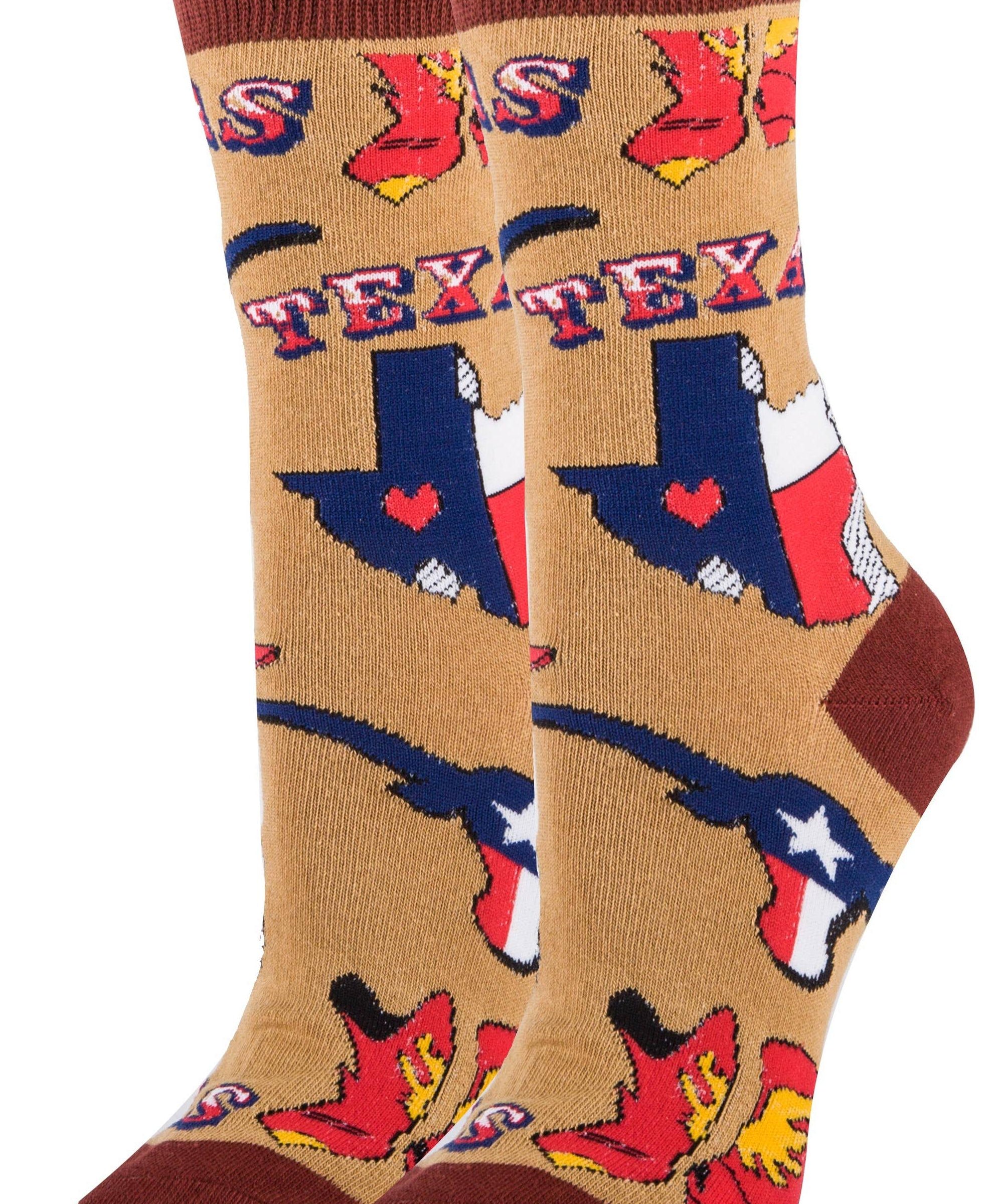 A pair of women's cotton crew socks with a novelty Texas design, featuring red and blue colors and the word 'Texas' on a light brown background.