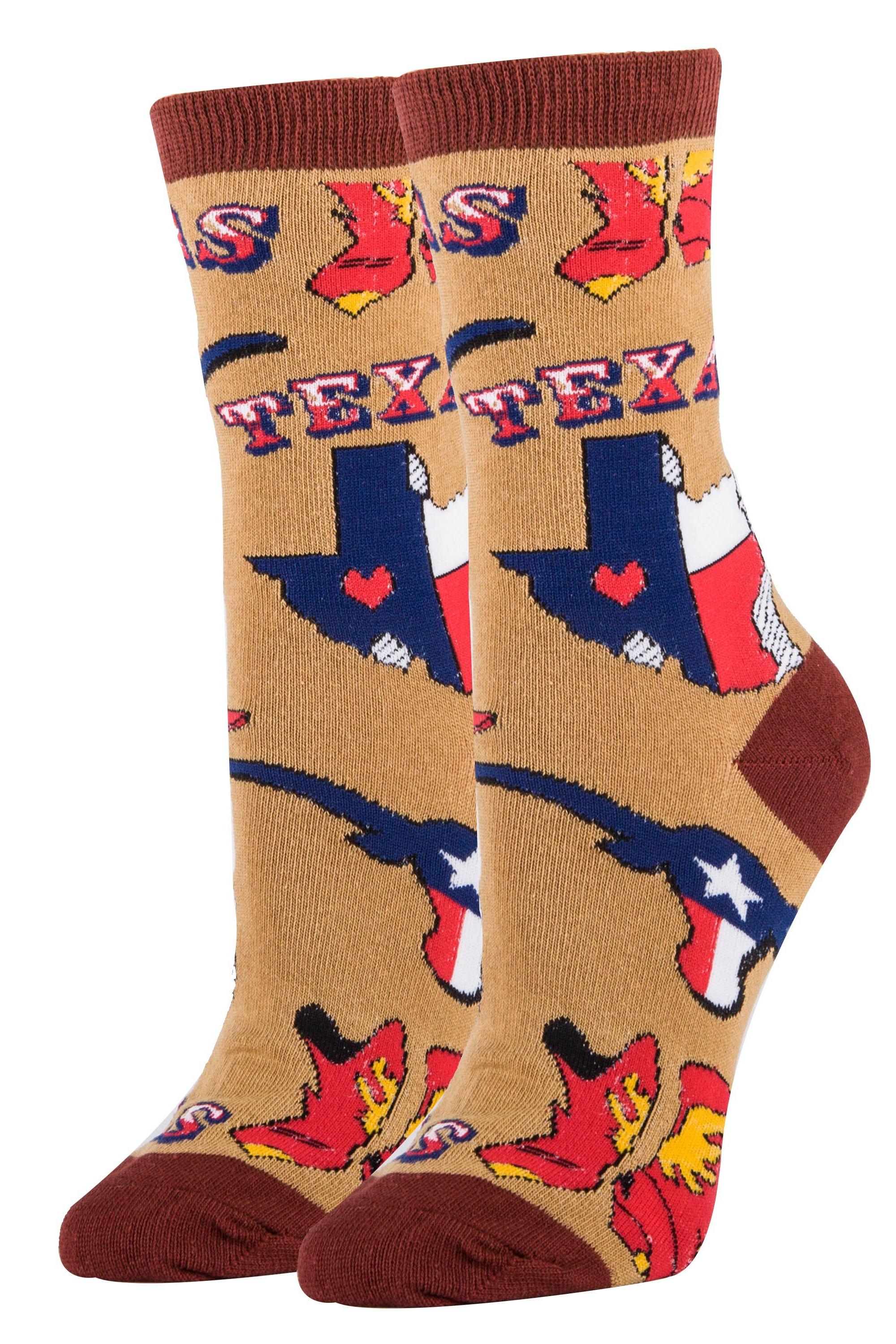A pair of women's cotton crew socks with a novelty Texas design, featuring red and blue colors and the word 'Texas' on a light brown background.